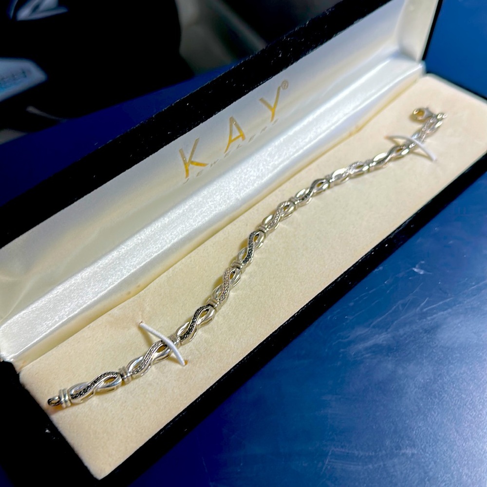 Silver bracelet with white and black gemstones